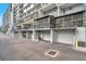 Side view of condominium balconies and garage doors, offering secure parking at 201 W Laurel St # 909, Tampa, FL 33602