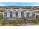 A low aerial shot of the building showing the balconies and mature landscaping at 201 W Laurel St # 909, Tampa, FL 33602