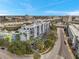 Low aerial view of condo building showing balconies and beautiful tree coverage surrounding property at 201 W Laurel St # 909, Tampa, FL 33602