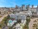 Panoramic view of a condo building showcasing an outdoor pool and city skyline on a clear, sunny day at 201 W Laurel St # 909, Tampa, FL 33602