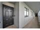 Exterior hallway view with windows leading to a black door and a smart lock system for unit 909 at 201 W Laurel St # 909, Tampa, FL 33602