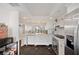 Charming kitchen featuring white cabinetry, stainless steel appliances, and marble countertop at 201 W Laurel St # 909, Tampa, FL 33602