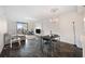 Bright living room with black marble floors, chandelier, and a balcony overlooking the city at 201 W Laurel St # 909, Tampa, FL 33602