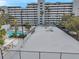 Aerial view of a condominium complex featuring an outdoor swimming pool with lounge area at 201 W Laurel St # 909, Tampa, FL 33602