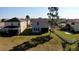 View of the backyard with a well-maintained lawn and white picket fence at 21211 Southern Charm Dr, Land O Lakes, FL 34637