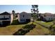 View of the backyard with a well-maintained lawn and white picket fence at 21211 Southern Charm Dr, Land O Lakes, FL 34637