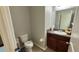 View of a clean half bathroom with wood-look flooring at 21211 Southern Charm Dr, Land O Lakes, FL 34637