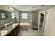 Bathroom features a soaking tub, separate shower, and a door leading to a walk-in closet at 21211 Southern Charm Dr, Land O Lakes, FL 34637