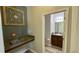 View into a clean half bathroom with a dark wood vanity at 21211 Southern Charm Dr, Land O Lakes, FL 34637