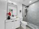 Modern bathroom featuring a sleek vanity, stylish mirror and a glass-enclosed shower at 2522 W North St, Tampa, FL 33614