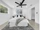 Bright bedroom features a ceiling fan, decor, and a window that brings in natural light at 2522 W North St, Tampa, FL 33614