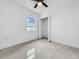 Bright bedroom featuring sleek flooring, recessed lighting and a window at 2522 W North St, Tampa, FL 33614