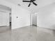 Bright bedroom featuring sleek flooring, a modern ceiling fan and neutral paint at 2522 W North St, Tampa, FL 33614