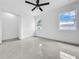 Bright bedroom featuring sleek flooring, recessed lighting and two windows at 2522 W North St, Tampa, FL 33614