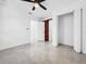 Bedroom featuring a barn door leading to an ensuite bathroom and sleek flooring at 2522 W North St, Tampa, FL 33614