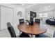 Dining area with a wooden table and black chairs, open to the living space at 2522 W North St, Tampa, FL 33614