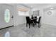 Dining room with stylish table and chairs, adjacent to the front door at 2522 W North St, Tampa, FL 33614