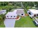 Exterior aerial shot showing front yard, driveway, and landscaping at 2522 W North St, Tampa, FL 33614