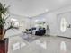 Bright living room featuring tile flooring, and view of the front yard at 2522 W North St, Tampa, FL 33614