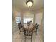 Charming breakfast nook with a marble top table and three windows offering natural light at 3600 105Th N Ave, Clearwater, FL 33762