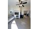 Bright Florida room with tile flooring, ceiling fan, and access to adjacent rooms at 3600 105Th N Ave, Clearwater, FL 33762