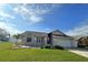 Charming single-story home boasts a manicured lawn and attached two-car garage at 3600 105Th N Ave, Clearwater, FL 33762