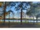 Scenic lake view through the trees with walking path at 3600 105Th N Ave, Clearwater, FL 33762