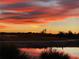 Vibrant red sunset reflecting over the lake at 3600 105Th N Ave, Clearwater, FL 33762