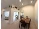 Open-concept floor plan with a dining table adjacent to the living room at 3600 105Th N Ave, Clearwater, FL 33762