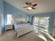 Spacious main bedroom with a slider that opens to a spa at 3600 105Th N Ave, Clearwater, FL 33762