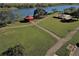 Aerial view of park with playground, gazebo, pathways and lake at 3600 105Th N Ave, Clearwater, FL 33762