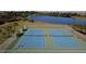 Overhead view of community tennis courts by the lake at 3600 105Th N Ave, Clearwater, FL 33762