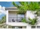 Balcony with modern outdoor seating overlooking the backyard at 5095 San Martino Dr, Wesley Chapel, FL 33543