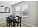 Cozy dining room with a dark wood table set, perfect for intimate meals and casual gatherings at 5095 San Martino Dr, Wesley Chapel, FL 33543