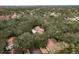 An aerial view shows apartment buildings surrounded by trees in a residential neighborhood at 515 Mistletoe Ct # C, Safety Harbor, FL 34695