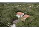 An aerial view shows apartment buildings nestled among beautiful mature oak trees at 515 Mistletoe Ct # C, Safety Harbor, FL 34695