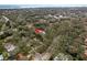 An aerial view highlights the property's location amidst lush greenery and mature trees in a desirable neighborhood at 515 Mistletoe Ct # C, Safety Harbor, FL 34695