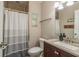 Bathroom featuring a tiled shower, vanity with counter space, and convenient fixtures at 515 Mistletoe Ct # C, Safety Harbor, FL 34695