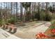 Bocce ball court surrounded by trees and benches, offering a relaxing recreational space at 515 Mistletoe Ct # C, Safety Harbor, FL 34695