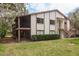 Charming two-story condo with private screened balcony, lush green lawn, and nicely maintained landscaping at 515 Mistletoe Ct # C, Safety Harbor, FL 34695