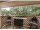 Patio with a wooden fence that offers a partial view of the trees and sky at 515 Mistletoe Ct # C, Safety Harbor, FL 34695