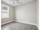 Empty bedroom with wood floors, large window, and ceiling fan at 5341 71St N Way, St Petersburg, FL 33709