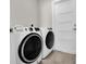 Modern laundry room with front-loading washer and dryer at 5341 71St N Way, St Petersburg, FL 33709