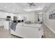 Open floor plan featuring a modern living room and pristine white kitchen at 5341 71St N Way, St Petersburg, FL 33709