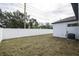 Fenced backyard featuring ample green space and the exterior of the home at 5351 71St N Way, St Petersburg, FL 33709