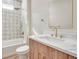 Elegant bathroom features decorative tile accent wall, soaking tub and modern vanity with marble countertop at 5361 71St N Way, St Petersburg, FL 33709