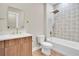 Elegant bathroom features decorative tile accent wall, soaking tub and modern vanity with marble countertop at 5361 71St N Way, St Petersburg, FL 33709