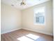 This bright bedroom features a ceiling fan and a window that lets in natural light at 5361 71St N Way, St Petersburg, FL 33709