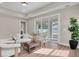 Bright living room featuring neutral tones, wood floors, and a sliding glass door to the patio at 5361 71St N Way, St Petersburg, FL 33709