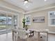 Bright living room featuring neutral tones, wood floors, and a sliding glass door to the patio at 5361 71St N Way, St Petersburg, FL 33709